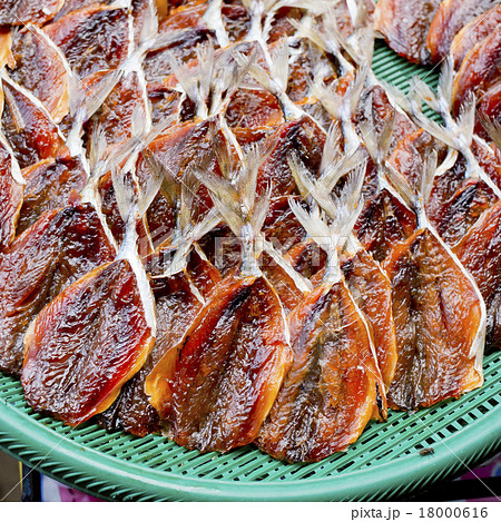 Dried fishes in the green basket 18000616