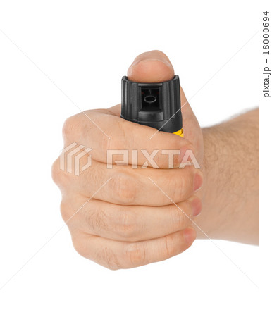 Hand with bottle of pepper spray 18000694