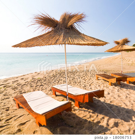 Beach umbrellas on the white sand beach 18006753
