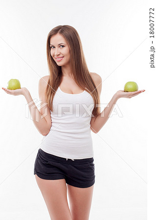 Attractive young girl with green fresh fruit Attractive young girl with green fresh fruit 18007772