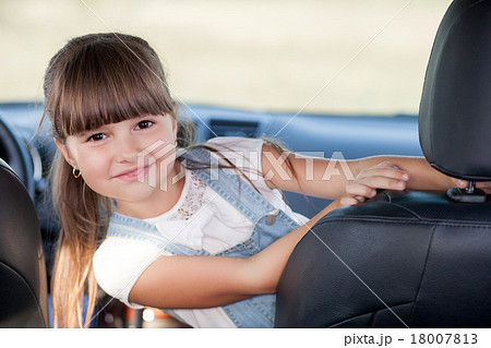 Cute female child is playing in vehicle 18007813