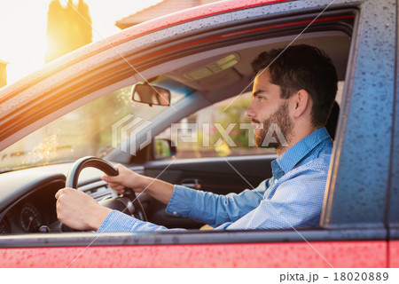 Man driving a car 18020889