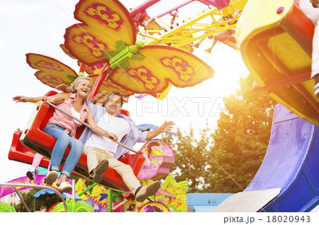 Senior couple in amusement park Senior couple in amusement park 18020943