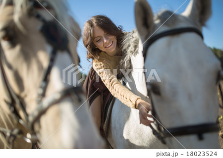 Beautiful girl riding a horse Beautiful girl riding a horse 18023524