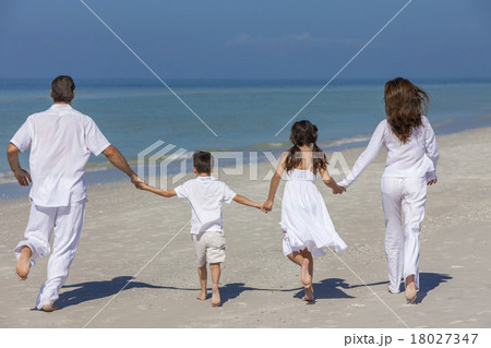 Mother Father and Children Family Running on Beach Mother Father and Children Family Running on Beach 18027347