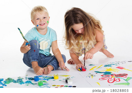 Boy and girl are drawing by aquarelle paints Boy and girl are drawing by aquarelle paints 18028803