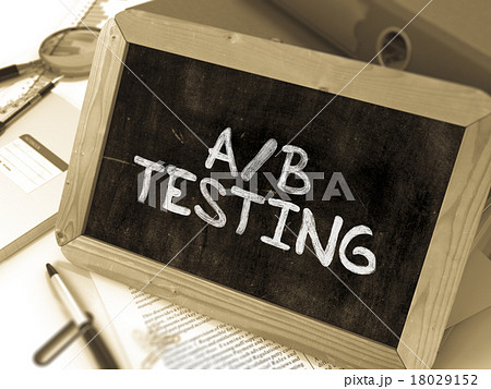 AB Testing Handwritten on Chalkboard. 18029152