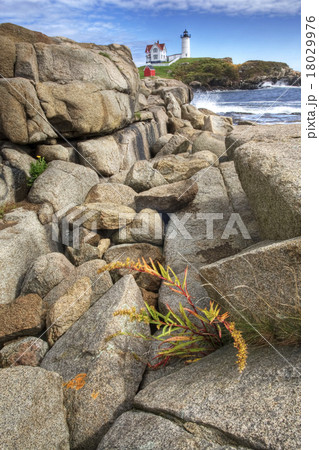 Nubble Light in Maine with boulders in the foregro 18029976