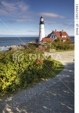 A vertical view of Portland Light in Maine on a be A vertical view of Portland Light in Maine on a be 18029981