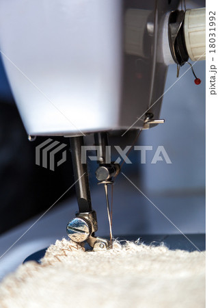 Sewing machine and fabric close up Sewing machine and fabric close up 18031992