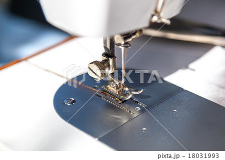 Sewing machine and fabric close up 18031993
