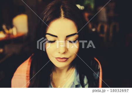 Close-up portrait of young closing eyes woman Close-up portrait of young closing eyes woman 18032697