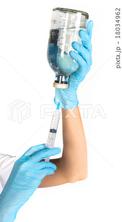 Female doctor picking up the syringe injection 18034962