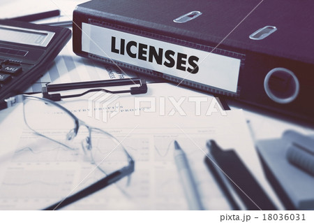 Licenses on Ring Binder. Blured, Toned Image. 18036031