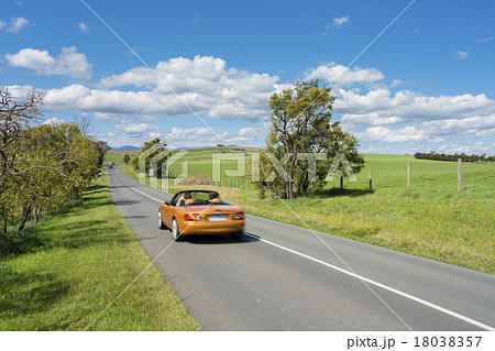 Car travelling on country road 18038357