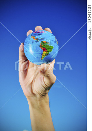 young man with a world globe in his hand vignetted 18041285