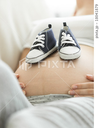 Concept shot of pregnant woman expecting baby Concept shot of pregnant woman expecting baby 18041879