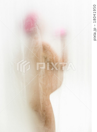 pregnant woman taking shower behind curtain 18041950