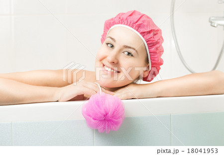 portrait of cute smiling woman posing in bath 18041953