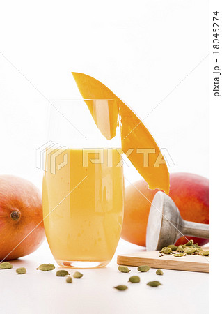 Glass Of Mango Smoothie Decorated With Fruit Slice 18045274