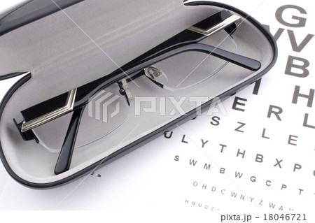 Eye glasses in a black case and eye chart Eye glasses in a black case and eye chart 18046721