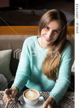 Charming woman in a restaurant 18047018