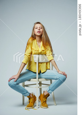girl with long hair posing in studio 18049366