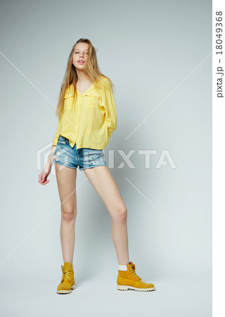 girl with long hair posing in studio 18049368