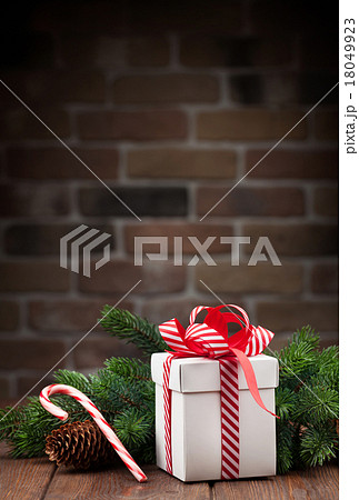 Christmas gift box and tree branch Christmas gift box and tree branch 18049923
