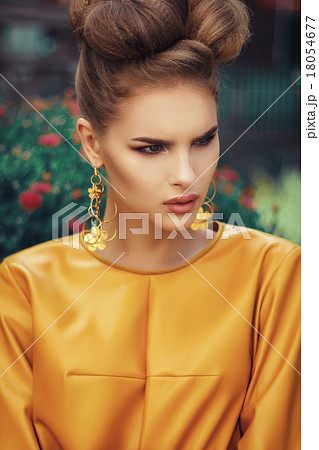 Beautiful girl in yellow dress with curly hair 18054677