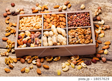 various dried nuts in wooden box various dried nuts in wooden box 18057629