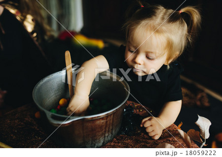 little girl playing in a witch 18059222