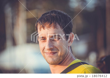 Handsome young man relaxing on a yacht, blue Handsome young man relaxing on a yacht, blue 18076412