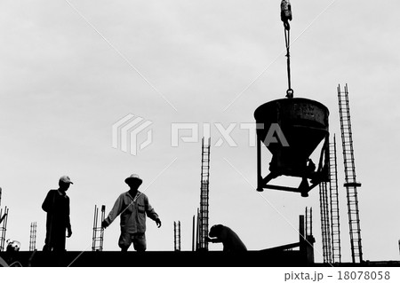 silhouette labor working in construction site 18078058