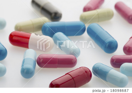Colorful medicine capsules on white background 18098687