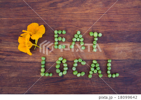 Sign "Eat Local" made of green peas Sign "Eat Local" made of green peas 18099642