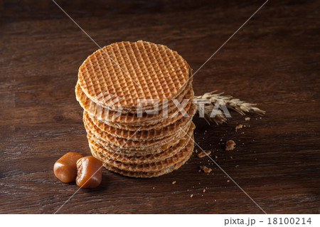Waffles with caramel on wood 18100214