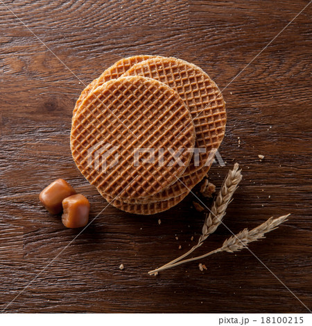 Waffles with caramel on wood 18100215