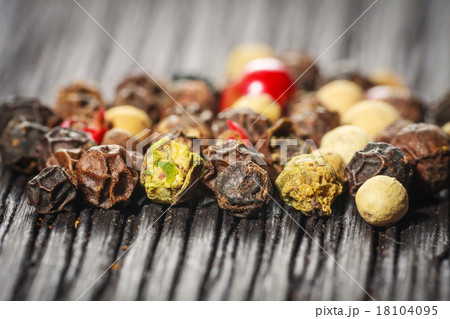 pepper corns on a wooden board pepper corns on a wooden board 18104095