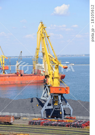 Port with cargo. Coal, tubes, ship, cranes. Port with cargo. Coal, tubes, ship, cranes. 18105612