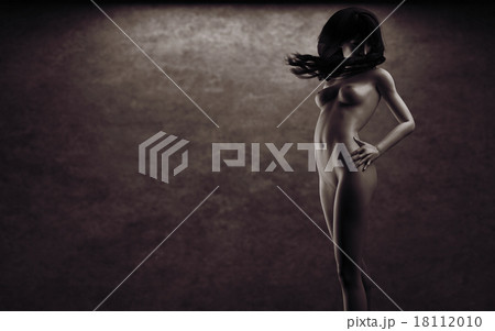 Beautiful naked young woman in the dark studio 18112010
