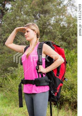 Blonde hiker looking for path 18112499