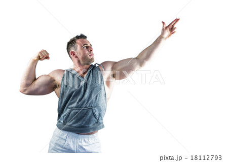Handsome bodybuilder posing with arms up Handsome bodybuilder posing with arms up 18112793
