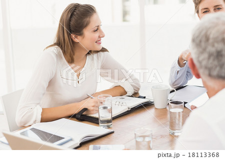 Smiling business people having a meeting 18113368