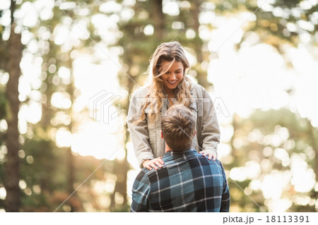 Man holding his smiling girlfriend 18113391