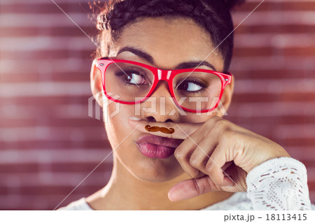 Happy hipster wearing a fake mustache Happy hipster wearing a fake mustache 18113415