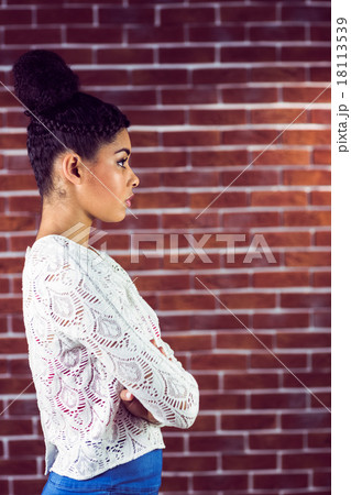 Close up of a serious woman looking away Close up of a serious woman looking away 18113539