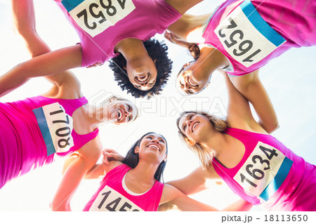 Five smiling runners supporting breast cancer marathon 18113650