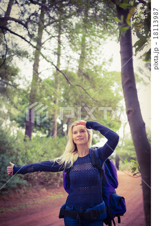 Pretty hitchhiker sticking thumb out Pretty hitchhiker sticking thumb out 18113987