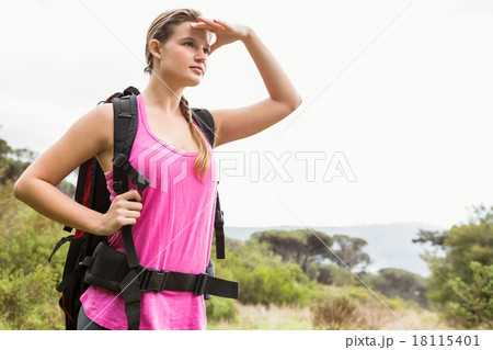 Blonde hiker looking for path 18115401